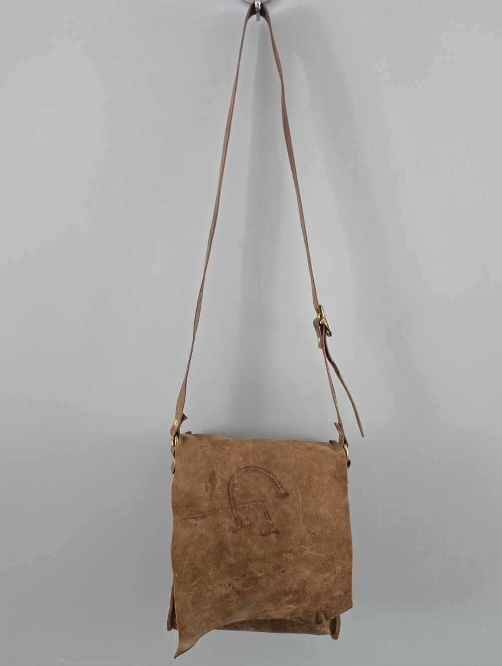 Vtg Distressed Tan Leather Embossed Logo Adjustable Buckle Strap Crossbody Bag